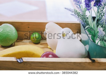 white birds plastic on Wood box , Vintage color filter