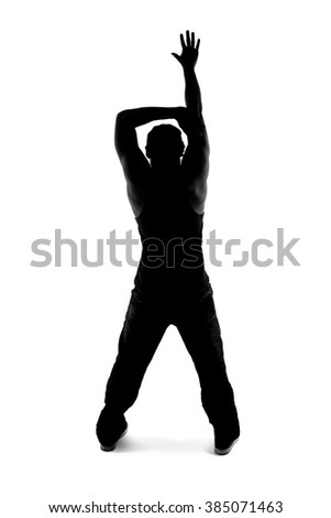 Black and white silhouette of a male dancer posing with dance moves.  He is backlit and in shadow to show off his body poses. 