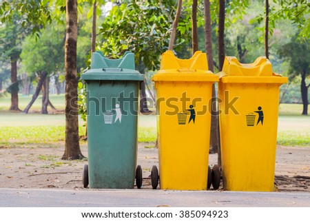 Recycle bins yellow and green in public park