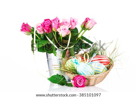Easter eggs and flowers on white background
