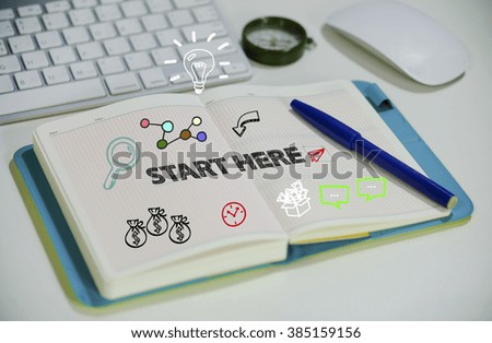 drawing START HERE concept on notebook in the office , business concept , business idea , strategy concept