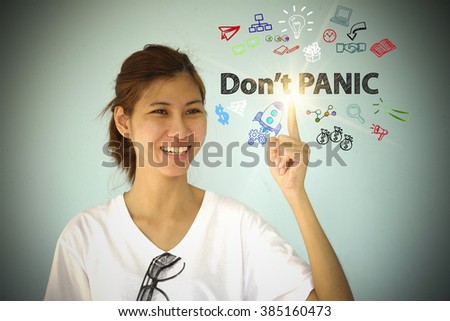young woman smiling and hand pointing at DON'T PANIC concept , business concept , business idea 
