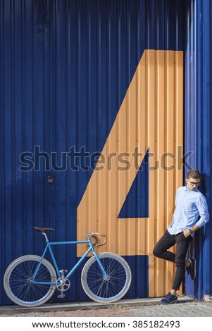 Picture of man posing with city bicycle