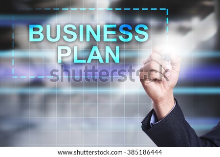 Businessman drawing on virtual screen "Business plan".