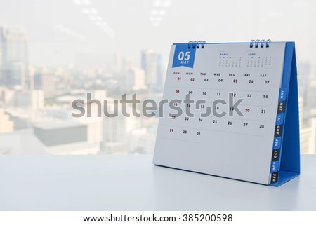 Calendar of May on the white table with city view background
