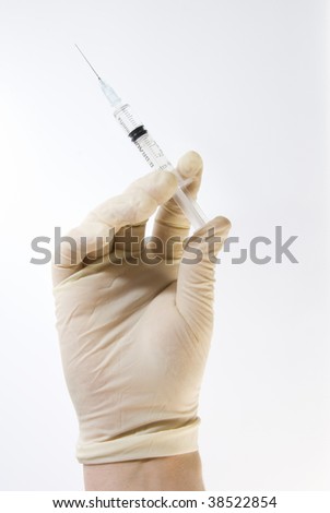 Gloved Hand Holding Hypodermic Needle Syringe Isolated on White Royalty-Free Stock Photo #38522854