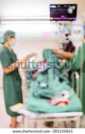 Blur of patient and healthcare  after surgery in the recovery room