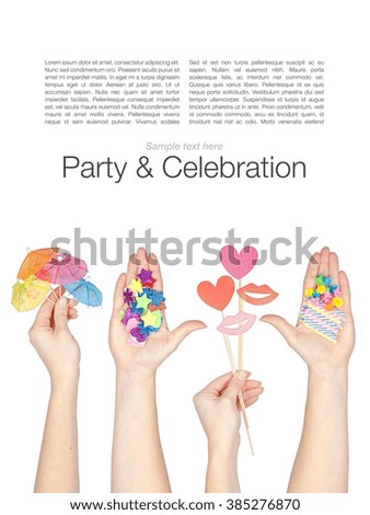 set of party and celebration elements in a hands isolated on white background