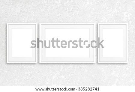 Three blank photo frames  on modern textured background