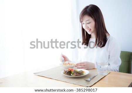 Women who eat breakfast , cereal Royalty-Free Stock Photo #385298017