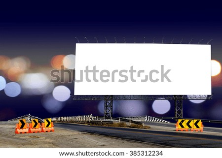 billboard and bridge with bokeh light in city night time