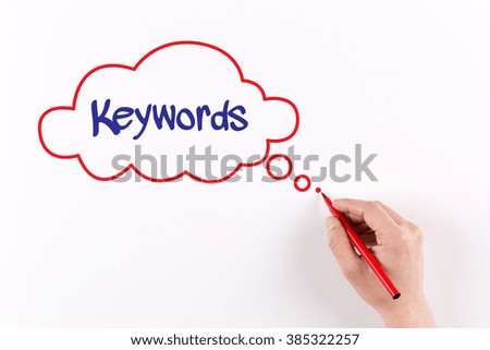 Hand writing Keywords on white paper, View from above