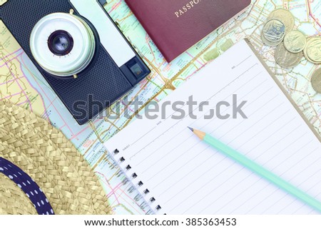 flat lay : set note, pencil, retro camera, passport, hat, coin on map for travel
remark : this picture use filter and adjust saturation