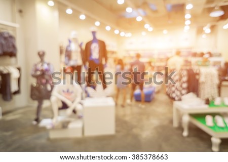 Blur of city shopping people crowd at marketplace shoe shop abstract background.vintage color Royalty-Free Stock Photo #385378663