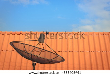 Satellite dish for communication technology on blue sky.