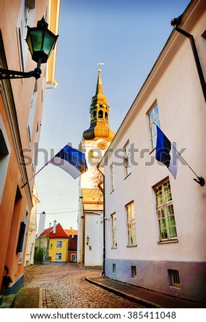 View of St.Mary Church and street with Estonian flags. Tallinn. Estonia