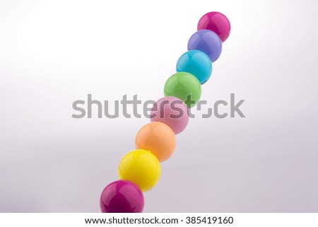 Color beads with facial expression on white background