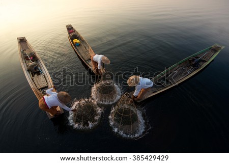 Traditional Burmese Fishermen at Inle lake, Myanmar Royalty-Free Stock Photo #385429429