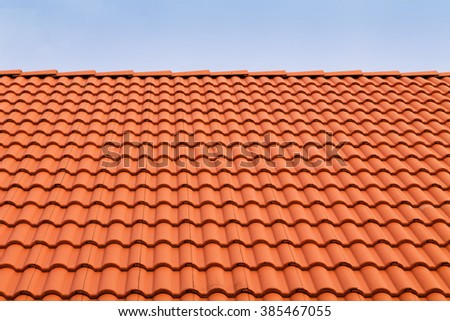 Tile roofs, patterns of blue sky Royalty-Free Stock Photo #385467055