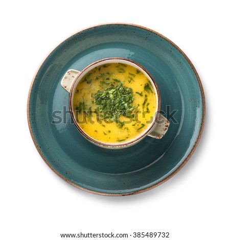 Yellow soup Chikirtma, isolated on white background, view from above