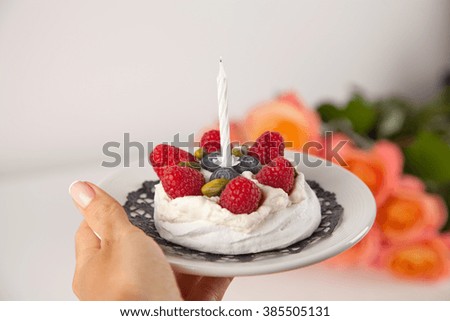 Tasty birthday cake with candle.