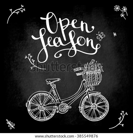 poster on the blackboard "open season" with bike, inscription