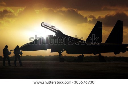 Military Aircraft at airfield on mission standby Royalty-Free Stock Photo #385576930
