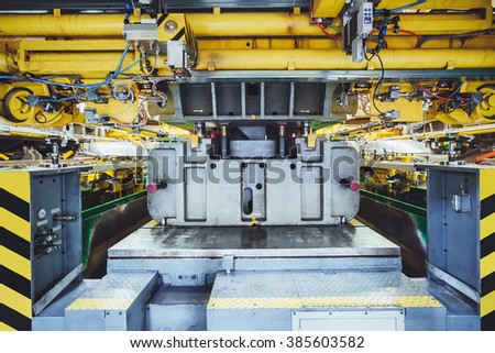hydraulic press on car manufacture Royalty-Free Stock Photo #385603582