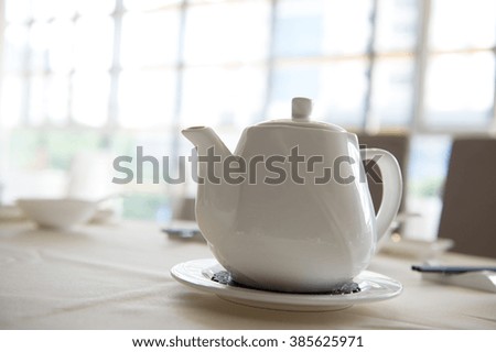Close-up of Chinese teapot on dining table.