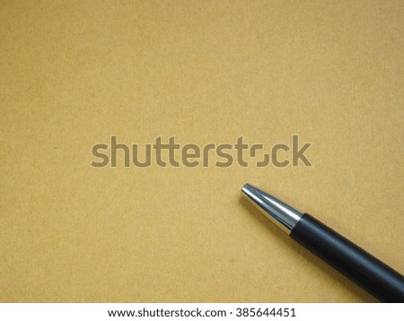 Blank brown paper with pen.