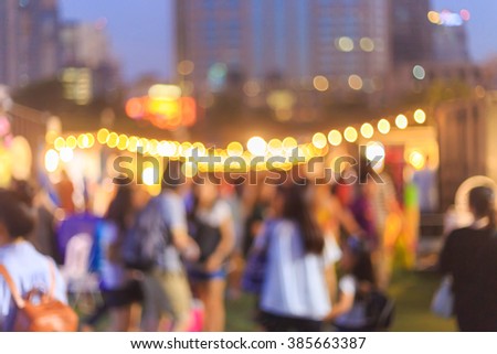 blurred background,people in plaza market at night