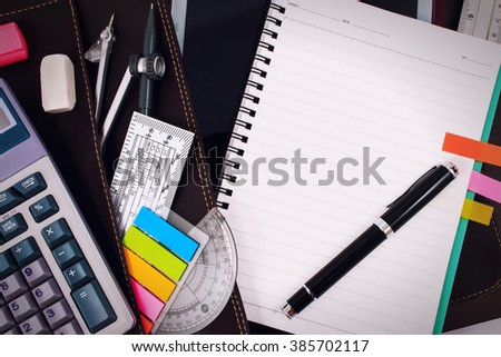 Office table desk or school supplies on table. School and office tools on office table. Desk with notebook or paper note and stationery object on office desk. Office desk concept. Math supplies.