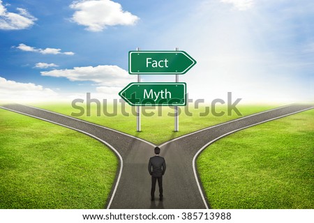 Businessman concept, Sign Fact or Myth road to the correct way. Royalty-Free Stock Photo #385713988