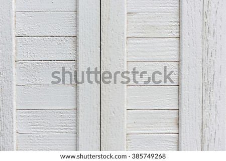window with closed beige wooden shutters. background photo
