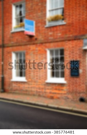  The blurry photo of building selling advertising signage represent the accommodation selling business and real estate concept related idea. 