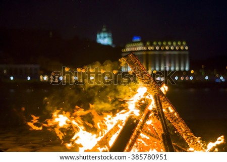 Bonfire on the background of the city lights