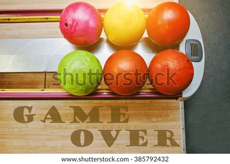 The word game over background bowling balls