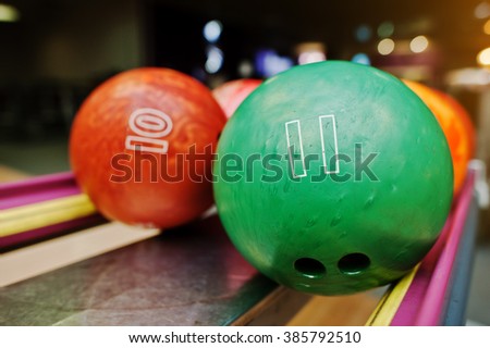Two colored bowling balls of number 11 and 10
