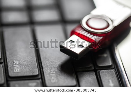 USB storage drive on computer keyboard