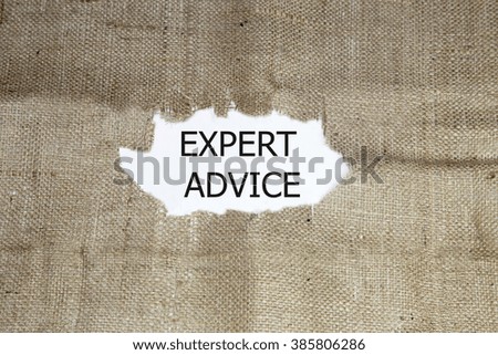expert advice word written under brown torn burlap