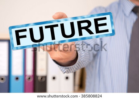 Businessman holding sign with inscription, FUTURE