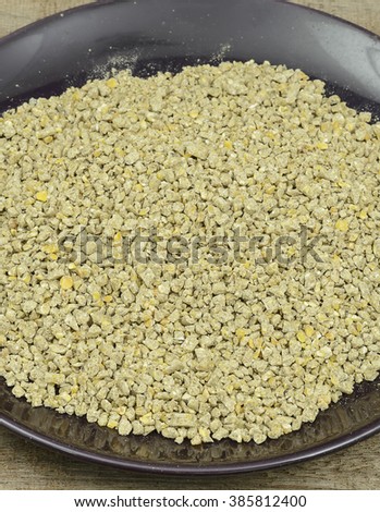 Special corn , meat and vegetable mix from all organic feed for chickens some Pelleted Compound Feed for Cattle in plate on Wood Background.animal food.