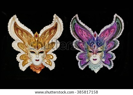 Two Venetian carnival masks isolated on black