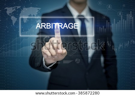 Businessman hand touching ARBITRAGE   button on virtual screen Royalty-Free Stock Photo #385872280