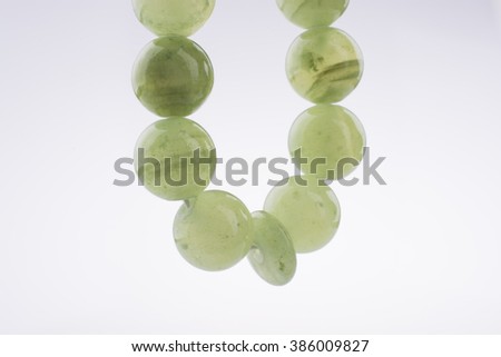 Green beads on a white background