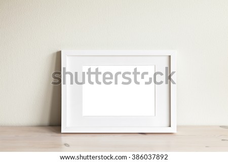 Image of a horizontal white frame mockup. 