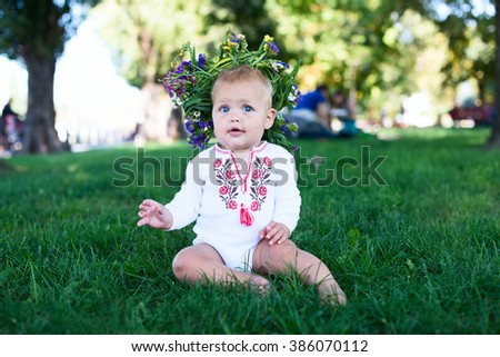 Happy Little Girl having Fun at the Summer Park. Cute Child with Flowers Wreath. Healthy Kids. Vintage Photo Effects