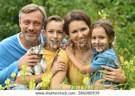 happy family at  blooming field