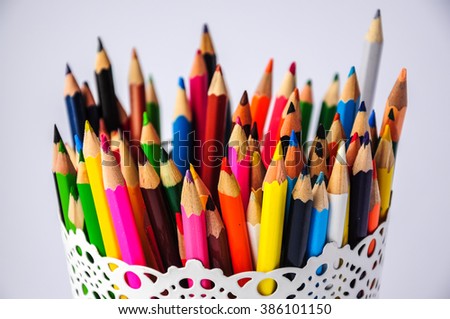 colored pencils in white pretty holder