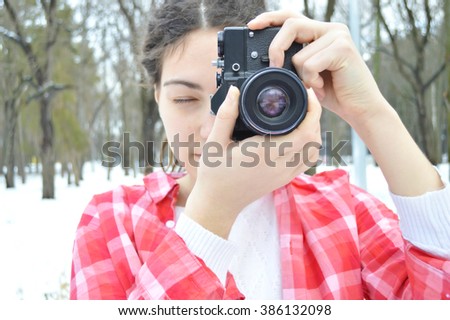 Close up of hands woman with old camera.Full-format camera.Photographer.Woman holding old vintage camera
